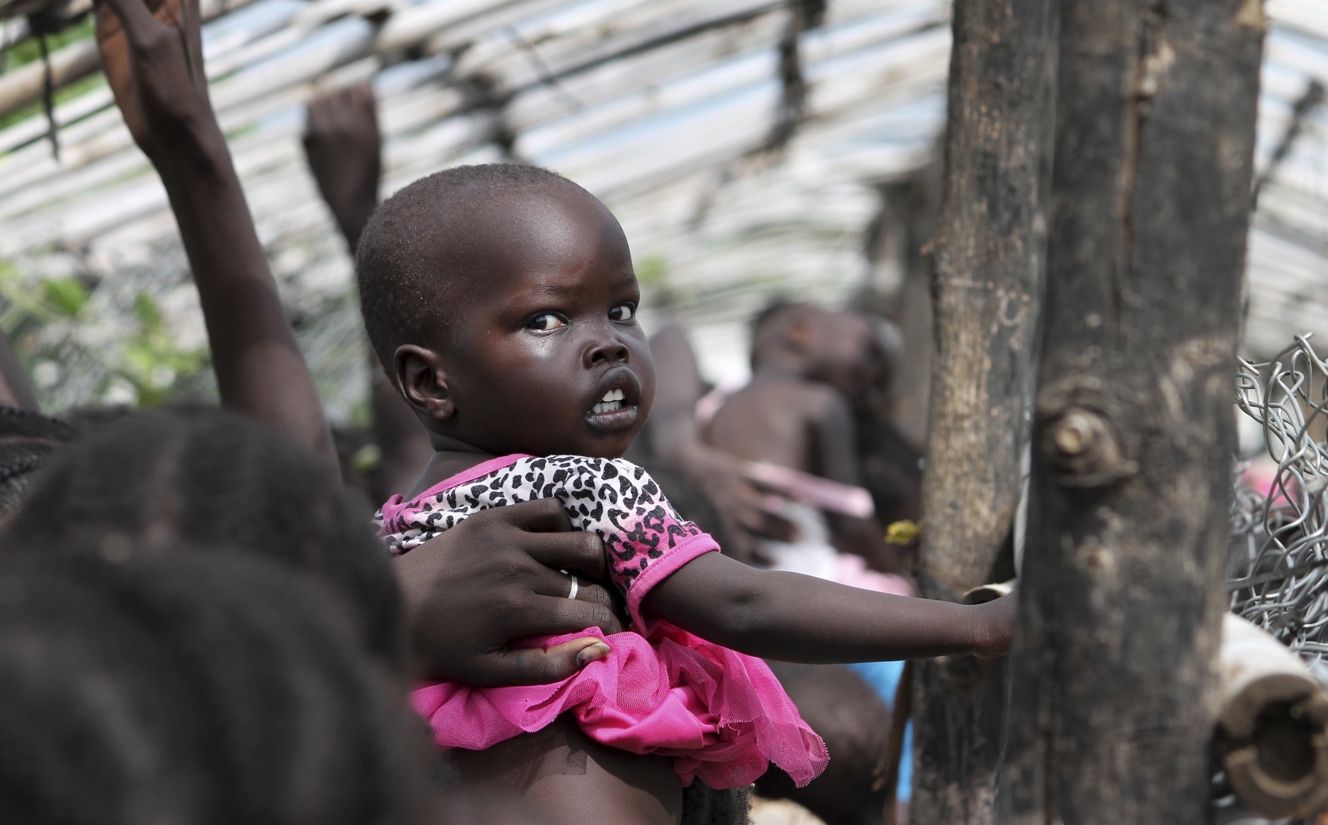 Displaced South Sudanese line up for food at a U.N. camp in Juba on July 25. The U.N. says hunger in South Sudan is at 'unprecedented' levels, affecting nearly 5 million people. | AP